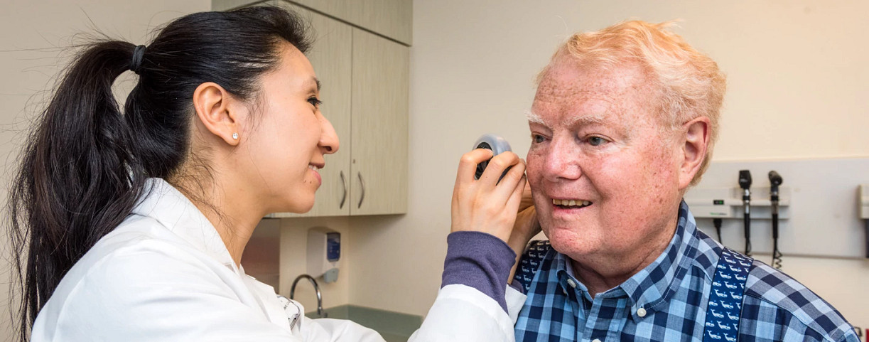 stephanie-liu-and-patient-during-dermotology-exam1440x584.jpg